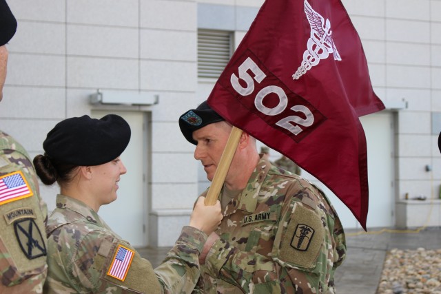 Capt. Dirks passes the guidon to 1st Sgt. Dilday