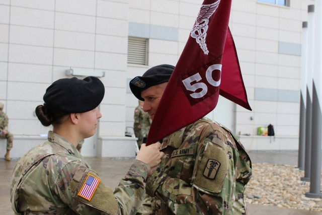 Capt. Dirks passes the company guidon to 1st Sgt. Dilday