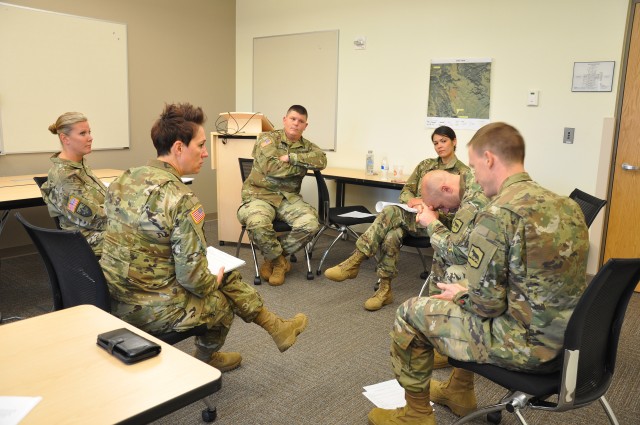 South Dakota Army National Guard go through a role playing exercise