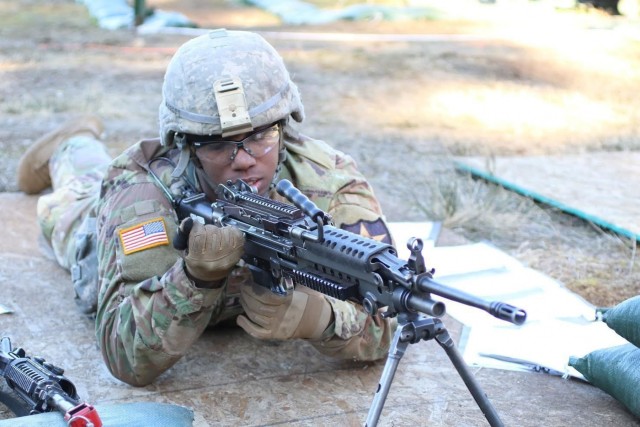 Lancer Soldier practices firing the M249