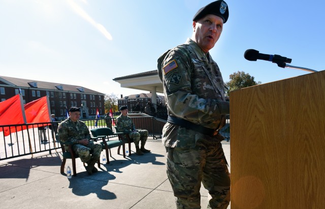 Fort Knox salutes 100th Training Division's Walter while embracing McLaughlin at change of command