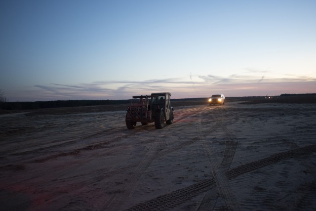 82nd Airborne Soldiers test forklift after cargo aircraft airdrop