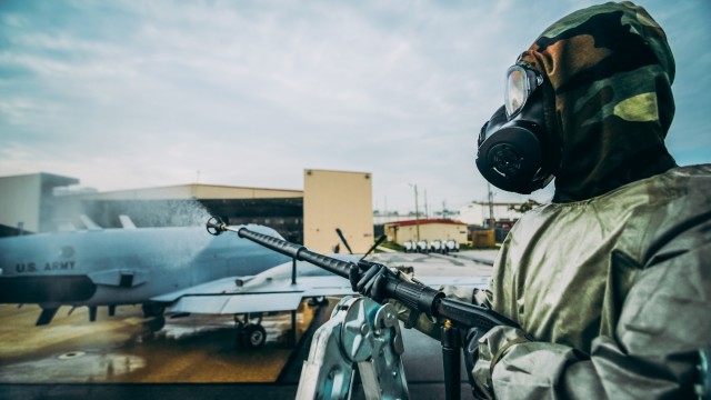 501st Military Intelligence Brigade Soldier Decontaminates Aircraft During CBRN Training