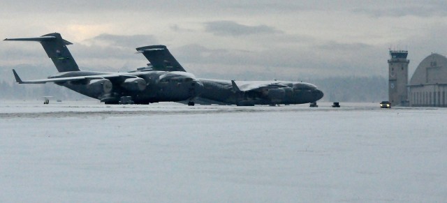 Temperatures are cooling down, JBLM's snow removal team heats up