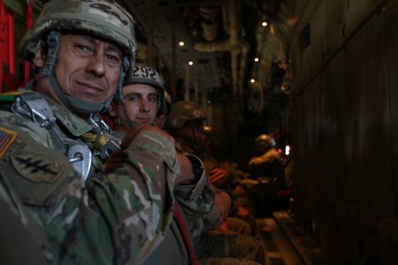 ミリタリー Walking U.S Army Sergeant A U.S. Army sergeant walks in front of a High Mobility
