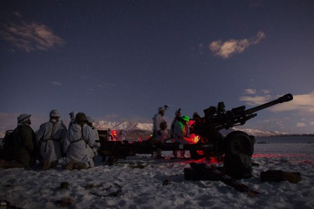 Army paratroopers set up a M119 105 mm howitzer at Malemute Drop Zone while conducting an airborne forced entry operation at Joint Base Elmendorf-Richardson, Alaska, Jan. 16, 2019. Paratroopers from 377th Parachute Field Artillery Regiment, 4th Infantry Brigade Combat Team (Airborne), 25th Infantry Division, conducted an airborne forced entry operation and follow on live-fire exercise while elements from the 6th Brigade Engineer Battalion acted as opposition forces. (U.S. Air Force photo by Alejandro Peña)