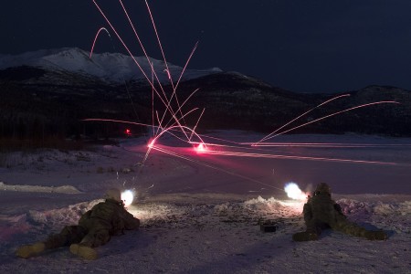 Soldiers assigned to Blackfoot Company, 1st Battalion, 501st Parachute Infantry Regiment, 4th Infantry Brigade Combat Team (Airborne), 25th Infantry Division, U.S. Army Alaska, fire M249 light machine guns at night during live-fire training at Grezelka range, Joint Base Elmendorf-Richardson, Alaska, March 4, 2019. Utilizing the M249 light machine gun and M240L machine gun, the Spartan paratroopers honed their marksmanship skills by engaging multiple targets at varying distances. (U.S. Air Force photo by Alejandro Peña)