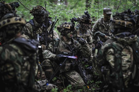 A 173rd Airborne Brigade Paratrooper gives directions to his troops while participating in Immediate Response 2019 at Pocek Training Area, Slovenia, May 15, 2019. Immediate Response 2019 is a multinational exercise co-led by Croatian armed forces, Slovenian armed forces, and U.S. Army Europe. (U.S. Army photo by Sgt. Henry Villarama) 