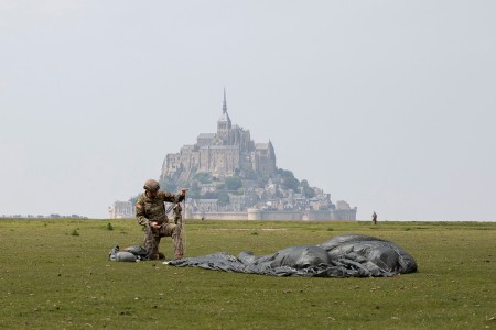 A paratrooper assigned to the U.S. Army’s 10th Special Forces Group (Airborne) conducts an airborne operation near the island of Mont Saint Michel, Avranches, France, May 18, 2019. This event comes at the invitation of the Mayor of Avranches in commemoration of World War ll special operations that laid the success for the Allied liberation of France, and a celebration of the strong alliance between France and the United States. (U.S. Army photo by Sgt. Alexis K. Washburn)