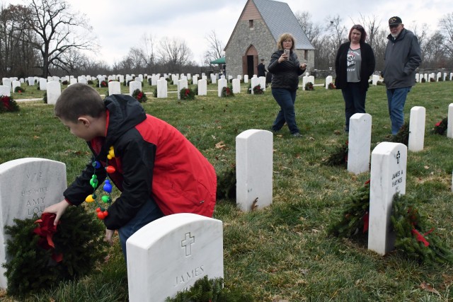 Volunteers honor military veterans with wreaths at Fort Knox Main Post Cemetery, Kentucky Veterans Cemetery -- Central