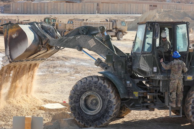 Soldiers with the South Carolina Army National Guard’s 124th Engineer Company, attached to the 206th Engineer Battalion, operate a front-end loader at Al Asad Air Base, Iraq, Jan. 23, 2020. The crew fortified defenses after a ballistic missile...