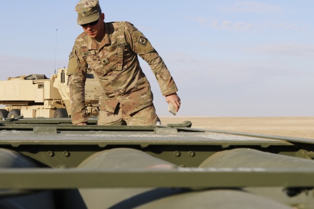 U.S, Kuwait artillery light up the night sky