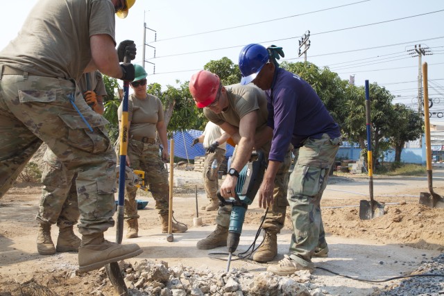 National Guard Soldiers from the 176th Engineering Co., Snohomish, Wash., break up concrete alongside Thai nationals as part of Exercise Cobra Gold in Phitsanulok, Thailand, Feb. 24, 2020. The exercise emphasizes coordination on civic action,...
