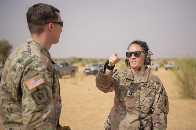 U.S. Army Capt. Amanda Justice (right), Civil Affairs Team 115, discusses Flintlock 20 convoy plans with Capt. Eric Goodrich, Civil Affairs Team 111 while in route to a designated drop zone outside of Kaedi, Mauritania, Feb.19, 2020. Flintlock is an annual, integrated military and law enforcement exercise that has strengthened key partner-nation forces throughout North and West Africa since 2005. Flintlock is U.S. Africa Command’s premier and largest annual Special Forces exercise.