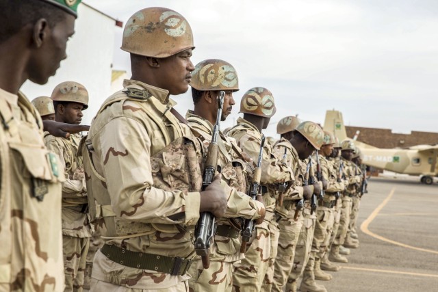 Mauritanian soldiers stand in formation during the Flintlock 2020 opening ceremony in Atar, Mauritania, Feb. 17, 2020. Flintlock is an annual integrated military and law enforcement exercise that has strengthened key partner-nation forces...