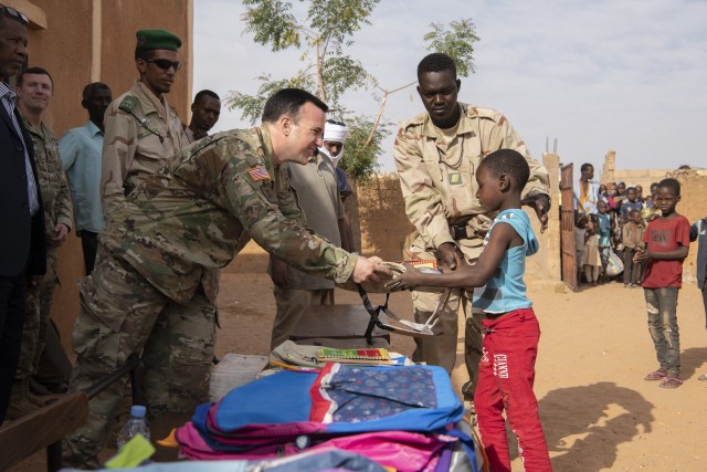 U.S. Army Civil Affairs Teams work with a Mauritanian Army Civil Military Cooperation Team to help distribute school supplies to children during Flintlock 2020, Kaedi, Mauritania, Feb.19, 2020. Flintlock is an annual, integrated military and law...