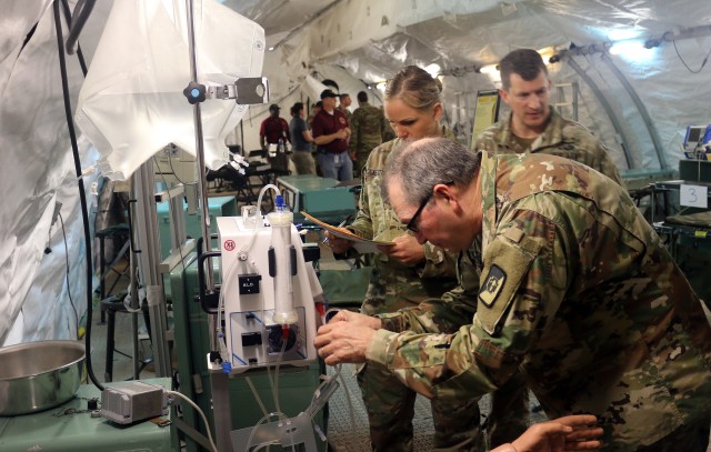 Test players conduct hands-on testing of the Extracorporeal Life Support device for patients with lung and kidney conditions. 