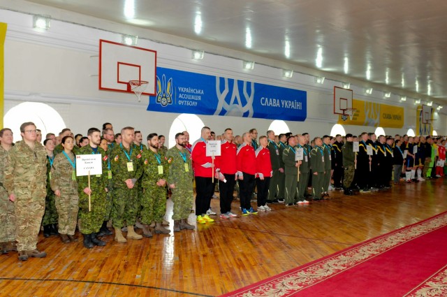Soldiers from Great Britain, Canada, Latvia, Ukraine, Poland, the United States, and other nations stand in formation during the opening ceremony of the 11th annual Kyiv Games in Kyiv, Ukraine, 12 Feb. 2020. Representatives from each nation...