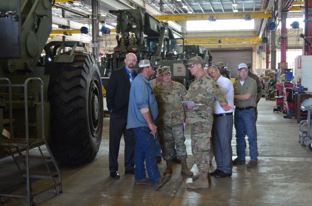 MG Mitchell tours Red River
