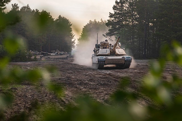 WIESBADEN, Germany - Soldiers aboard M1A2 Abram Tanks from 1st Squadron, 4th Cavalry Regiment, 1st Armored Brigade Combat Team, 1st Infantry Division start to move out, as part of an Initial Ready Task Force (IRTF) exercise, at Johanna Range, Poland, May 20, 2019. An IRTF is similar to an Emergency Deployment Readiness Exercise (EDRE) but on a smaller scale. An IRTF is a no-notice, rapid-deployment exercise designed to test a unit&#39;s ability to alert, marshal, and deploy forces and equipment for contingency operations or an emergency disaster.