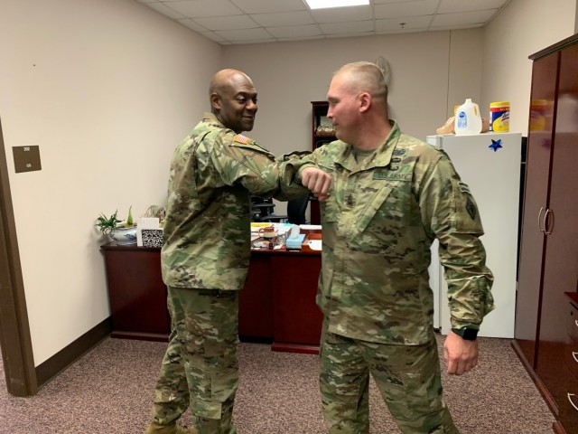 Brig. Gen. Milford H. ‘Beags’ Beagle Jr., Fort Jackson commander and Post Command Sgt. Maj. Jerimiah Gan demonstrate how to tap elbows as a greeting. As a means to prevent COVID-19 the Fort Jackson community is not to shake hands as a...