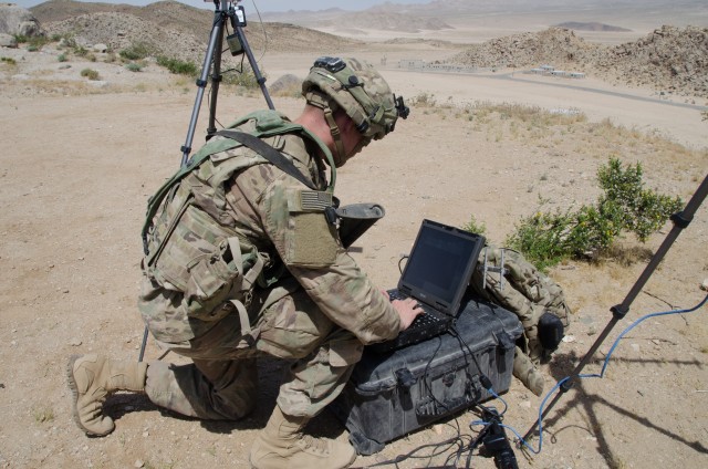 A Soldier with the 780th Military Intelligence Brigade sets up cyber tools overlooking the mock city of Razish at the National Training Center at Fort Irwin, Calif., May 5, 2017. The 780th participated in the NTC training rotation for the 2nd Armored Brigade Combat Team, 1st Infantry Division, as part of the Army Cyber Command-led Cyber-Electromagnetic Activities (CEMA) Support to Corps and Below initiative. The CSCB program is designed to help the Army define and develop cyberspace doctrine, organization, enabling support and integration into tactical units, in synchronization with related warfighting disciplines such as electronic warfare, information operations, network operations and intelligence.