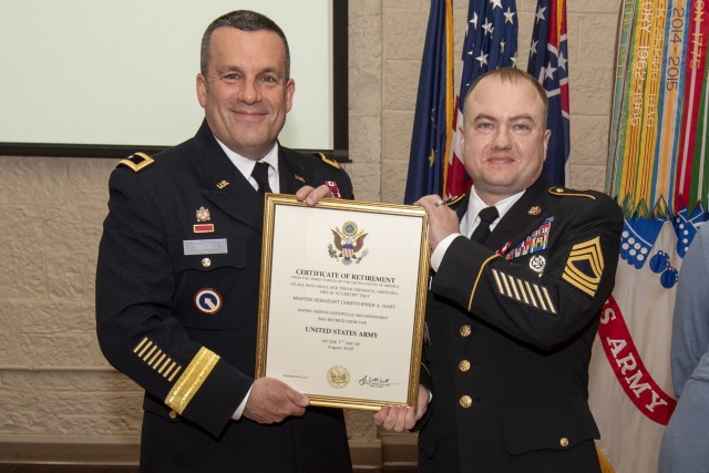 Master Sgt. Christopher Hart receives his certificate of retirement from Maj. Gen. Steven Shapiro, commanding general, U.S. Army Sustainment Command, during a ceremony held March 12 in Heritage Hall, Rock Island Arsenal, Illinois.
