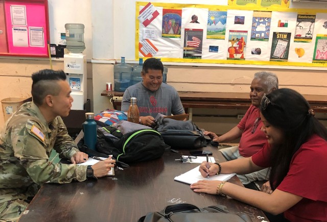2nd Lt./Dr. Thomas Lee works on finalizing logistics and signing the Memorandum of Agreement at the final planning meeting for Camp to the Future Palau with Palau’s Ministry of Health and Ministry of Education representatives at Palau High...