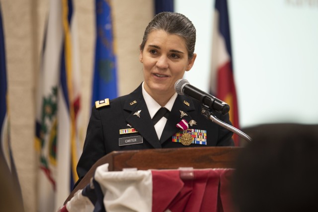 Lt. Col. Kathryn Carter, U.S. Army Sustainment Command-Army Reserve Element, thanks God and her family for her meaningful and fulfilling career during the ceremony held March 12 in Heritage Hall, Rock Island Arsenal, Illinois.