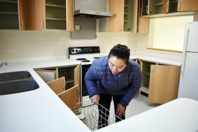 Mamiko Takishima, a housing inspector for the Housing Division, Directorate of Public Works, U.S. Army Garrison Japan, makes sure a dishwasher works inside a housing unit in the Sagamihara Family Housing Area, Japan, March 12, 2020.