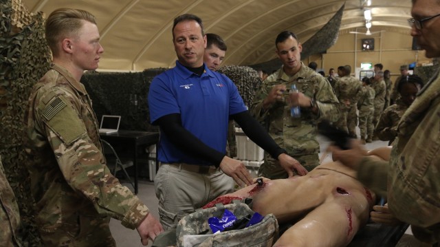 Rick Mormino, Director of Product Engineering at Trauma FX, instructs medics on how to operate the Tactical Combat Casualty Care Exportable in the U.S. Central Command Region on Feb. 12, 2020. The TC3X is a state of the art medical training device used to simulate an actual casualty that could be found on the battlefield. (U.S. Army photo by Pfc. Andrew Zook)