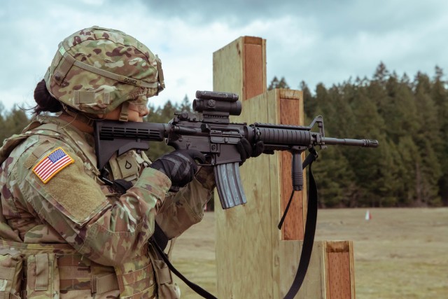 Pfc. Joanna Gaona Gomez begins the Army’s new weapons qualification test in the standing unsupported position before dropping to prone unsupported at Joint Base Lewis-McChord, Washington, March 3, 2020. After moving to the prone unsupported and supported positions, Soldiers use a barricade and have approximately nine seconds to change magazines and positions. (U.S. Army photo by Pfc. Laurie Ellen Schubert)