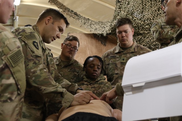 U.S. Army Staff Sgt. Richard McCarthy, 4-133rd Field Artillery Regiment, Texas National Guard, shows students how to replace the interchangeable parts on the Tactical Combat Casualty Care Exportable model of medical training mannequin produced by Trauma F/X in the U.S. Central Command region on Feb. 12, 2020. The TC3X is a state of the art medical training device used to simulate an actual casualty that could be found on the battlefield. (U.S. Army photo by Pfc. Andrew Zook.)