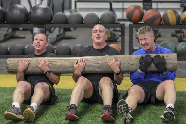 Command Sgt. Maj. Samuel Roark, 10th Mountain Division (LI) senior enlisted adviser (far right) conducts physical training at one of the training facilities at Fort Drum, N.Y. After 30 years of service, Roark is preparing to embrace the changes to...