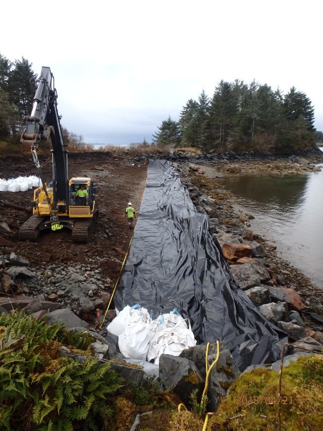 Placing D1 gravel bags on plastic sheeting along D1 bag footprint at Virublennoi_Landfill - South
