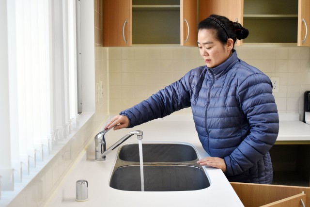 Mamiko Takishima, a housing inspector for the Housing Division, Directorate of Public Works, U.S. Army Garrison Japan, checks a kitchen faucet inside a housing unit in the Sagamihara Family Housing Area, Japan, March 12, 2020.