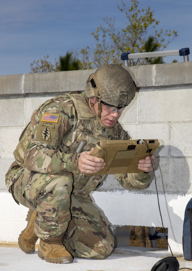 Staff Sgt. David Ervin (left) examines an X-ray of an unmanned aircraft system with internal and external explosives during Raven’s Challenge on March 4, 2020. Soldiers with the 744th Ordnance Company (EOD) were required to figure out how to...