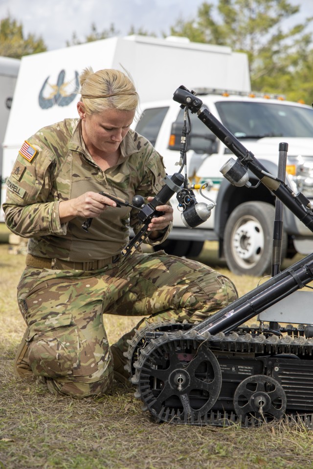 Staff Sgt. Heather Cockrell, 744th Ordnance Company (EOD), adjusts the arm of a robot the during Raven’s Challenge on March 4, 2020. Raven’s Challenge is an annual series of events that enhances the interoperability of explosive ordnance...