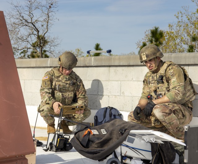 Staff Sgt. David Ervin (left) examines an X-ray of an unmanned aircraft system with internal and external explosives as Staff Sgt. Jonathan Pando observes the device during Raven’s Challenge on March 4, 2020. Both of the 744th Ordnance Company...