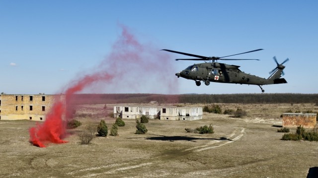 A MEDEVAC helicopter from 2-3 General Support Battalion, 3rd Combat Aviation Brigade, 3rd Infantry Division, prepares for landing during Hawk Strike in Hungary on March 5. Hawk Strike allows units to conduct movements in a realistic, high-intensity environment to ensure readiness and the ability to fully integrate with any NATO partner and ally, such as the Hungarian Forces.