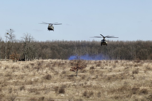 Helicopters from 2-3 General Support Battalion, 3rd Combat Aviation Brigade, 3rd Infantry Division, fly towards the landing zone during Hawk Strike in Hungary on March 5. Hawk Strike allows units to conduct movements in a realistic, high-intensity environment to ensure readiness and the ability to fully integrate with any NATO partner and ally, such as the Hungarian Forces.