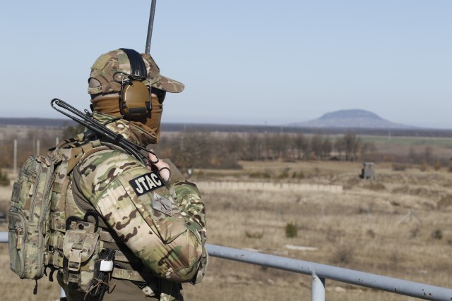 A Soldier from the Hungarian 2nd Special Operations Forces conducts a radio check during Hawk Strike in Hungary on March 5. Hawk Strike allows units to conduct movements in a realistic, high-intensity environment to ensure readiness and the...