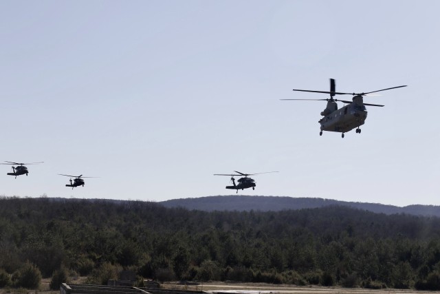 Helicopters from 2-3 General Support Battalion, 3rd Combat Aviation Brigade, 3rd Infantry Division, fly towards the landing zone during Hawk Strike in Hungary on March 5. Hawk Strike allows units to conduct movements in a realistic, high-intensity environment to ensure readiness and the ability to fully integrate with any NATO partner and ally, such as the Hungarian Forces.