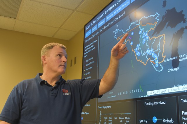 Phil White, St. Paul District readiness operations center chief, discusses the capabilities and benefits of the new dashboard system recently installed. The system pulls real-time data from a variety of platforms and displays them in a simplified...
