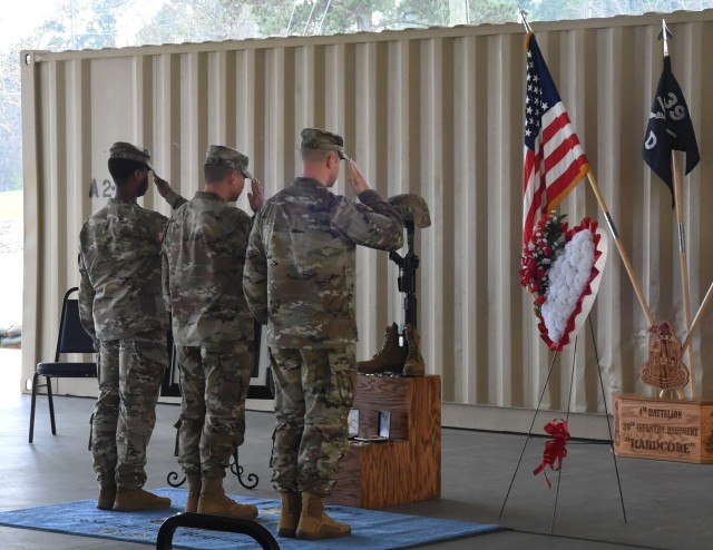 A group of Soldiers salute Pvt. Angel Iram Cortes-Torres’ ‘Soldiers’ Cross’ during his memorial ceremony March 17 on Fort Jackson. Cortes-Torres was a trainee from Company D, 4th Battalion, 39th Infantry Regiment. His ‘Soldiers’ Cross’ consists of the boots, rifle, dog tags, and helmet that he was issued during Basic Combat Training. (Photo by Ms. Taylor Marie Smith, Fort Jackson)