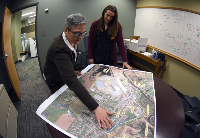 Project manager Nan Bischoff and lead Planner Katie Opsahl review features of the Arcadia flood risk management study.