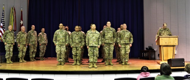 Leadership from the U.S. Army Reserve Cyber Protection Brigade and 335th Signal Command (Theater), recognize Soldiers assigned to Detachment 1 - USAR-CPB, during a ceremony at the Army Research Laboratory, College Park, Maryland, February 22. The Detachment assembled for the ceremony to receive official deployment orders for the next rotation to the Regional Cyber Center -- Southwest, Asia. Maj. Moon K. Lee, detachment commander, stands in front of the formation during the reading of the official order. (U.S. Army Reserve Photo by Sgt. Erick Yates)