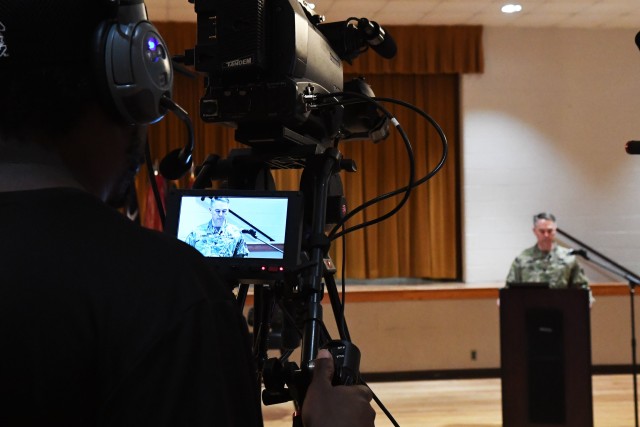 A cameraman records Fort Jackson Garrison Commander Col. John “Wes” Hankins as he addresses military housing residents during a virtual community town hall March 17. With current social restrictions in place to prevent the spread of COVID-19,...