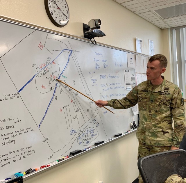 Staff Sgt. David Clifton provides his classmates from the BSNCOC 10-20 with a briefing of movement and maneuver elements. students of the course graduated March 21. 
Courtesy Photo