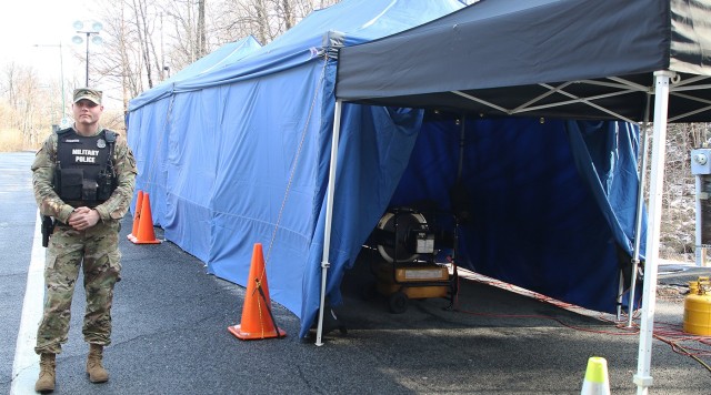 Sgt. Nicholas Ardinger, West Point Military Police, guards the blue tent that is located at Stony Lonesome Gate. All people entering West Point are now screened for possible symptoms of COVID-19. Anyone with symptoms  are sent for a secondary screening in the blue tent with medics and then may be directed to medical facilities or self-quarantine